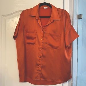 Bright orange top from Vici